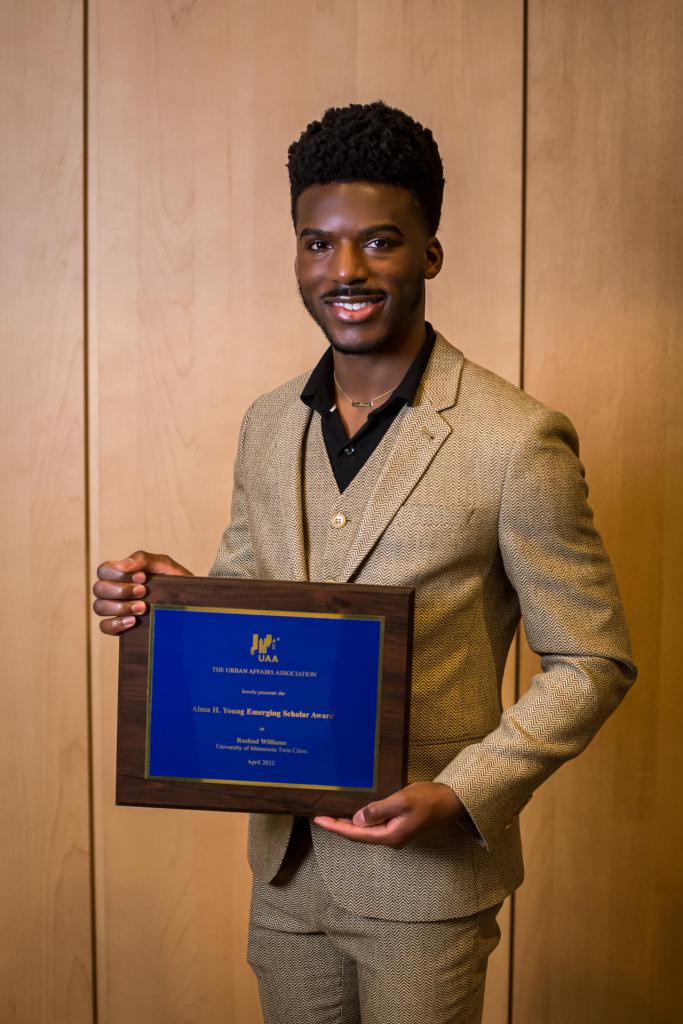Rashad Williams holds his award.
