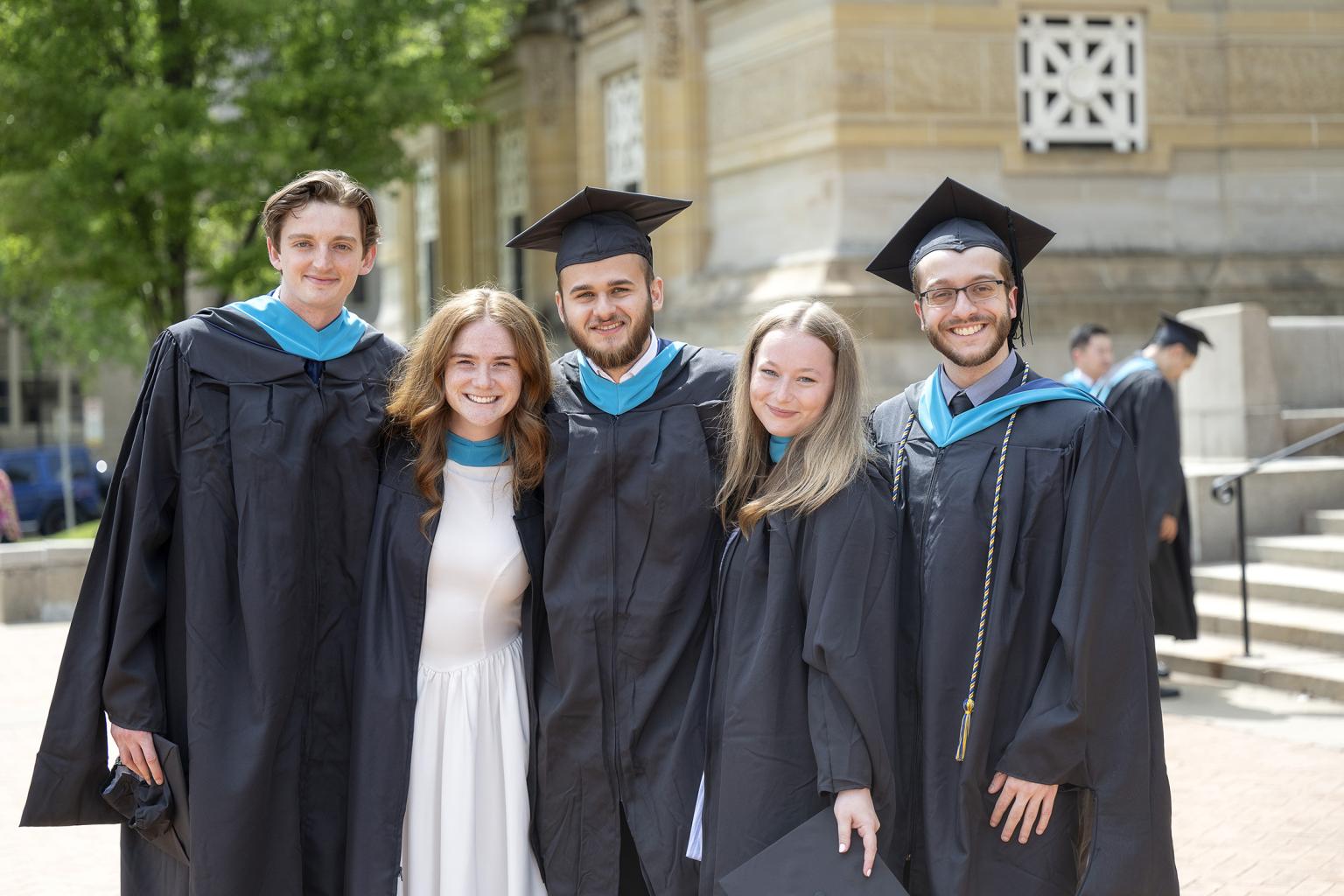 Students gather after graduating