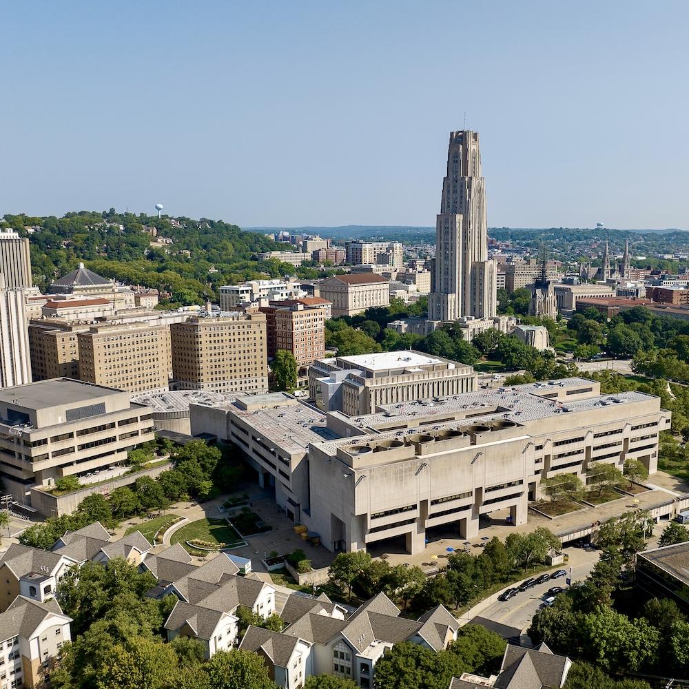 Drone image of the Pitt campus with Posvar Hall in the foreground